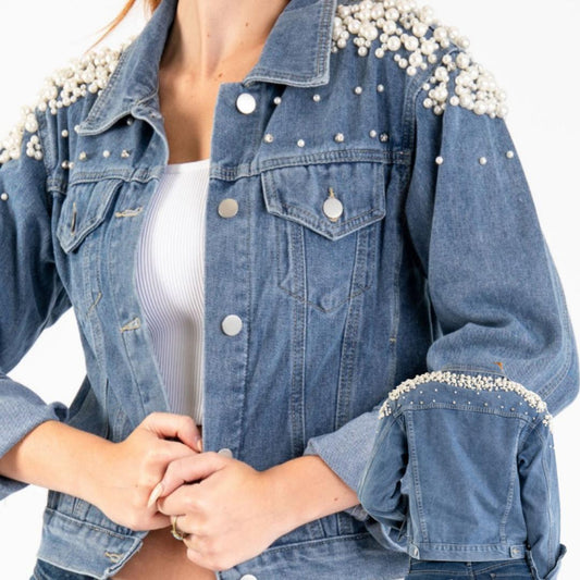 A denim jacket with embroidered pearl accents on the collar and pockets, featuring front pockets and button closure.